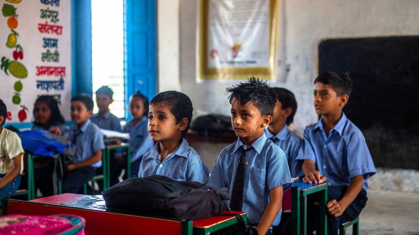 Schoolchildren in uniform in their classroom